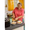 thumbnail image of older woman preparing lunch