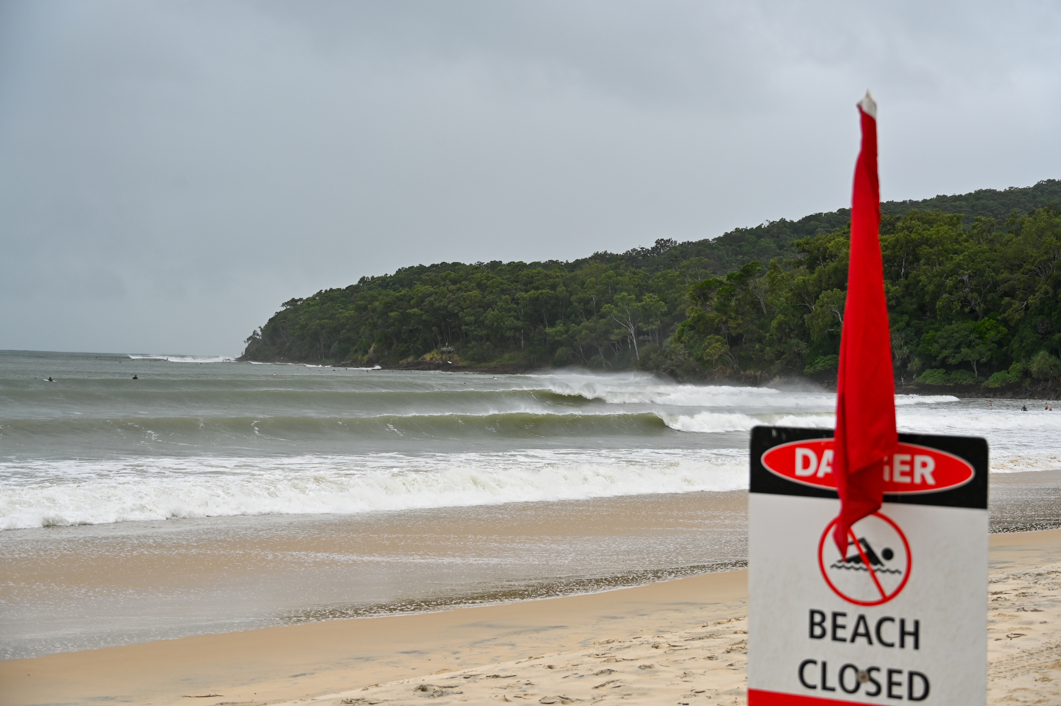 Beach closed sign on a Gold Coast beach during Cyclone Alfred