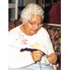 thumbnail image of older indigenous woman knitting