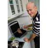 thumbnail image of older man cooking a steak dinner