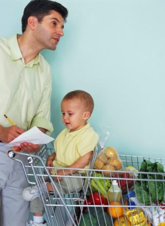 man shopping with his young child