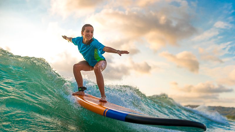 young girl surfing