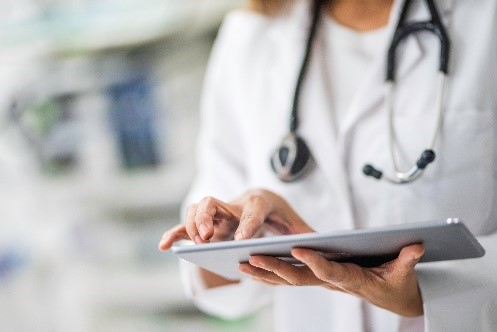 picture of medical professional holding an ipad