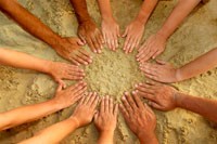 peoples hands forming a circle