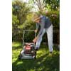 thumbnail image of older man mowing the lawn