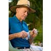 thumbnail image of older man cleaning glasses