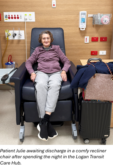 Patient Julie sits in a recliner chair in the Logan Transit Care Hub