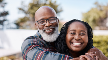 Smiling happy middle-aged black couple