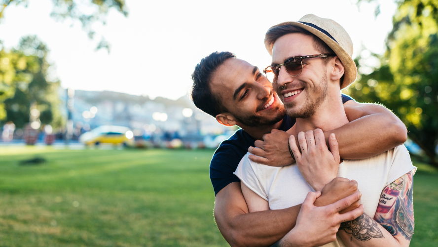 A photo of two men hugging each other