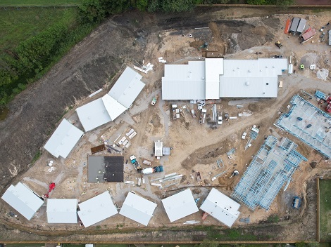 Aerial overhead view of construction site with an assortment of buildings being built