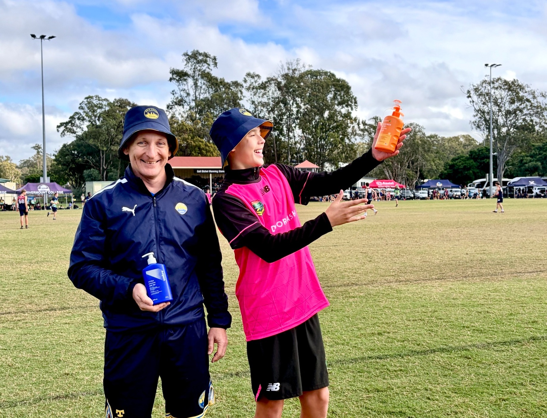 Gold Coast Touch Association General Manager Lee Rossow and youth referee Connor Beck are sun safety champions