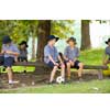 Image of kids sitting in the park