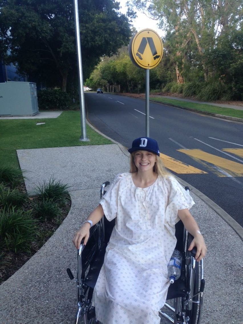 A photo of Kate in a wheelchair. 