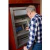 thumbnail image of older man using an ATM