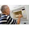 thumbnail image of older man using a microwave
