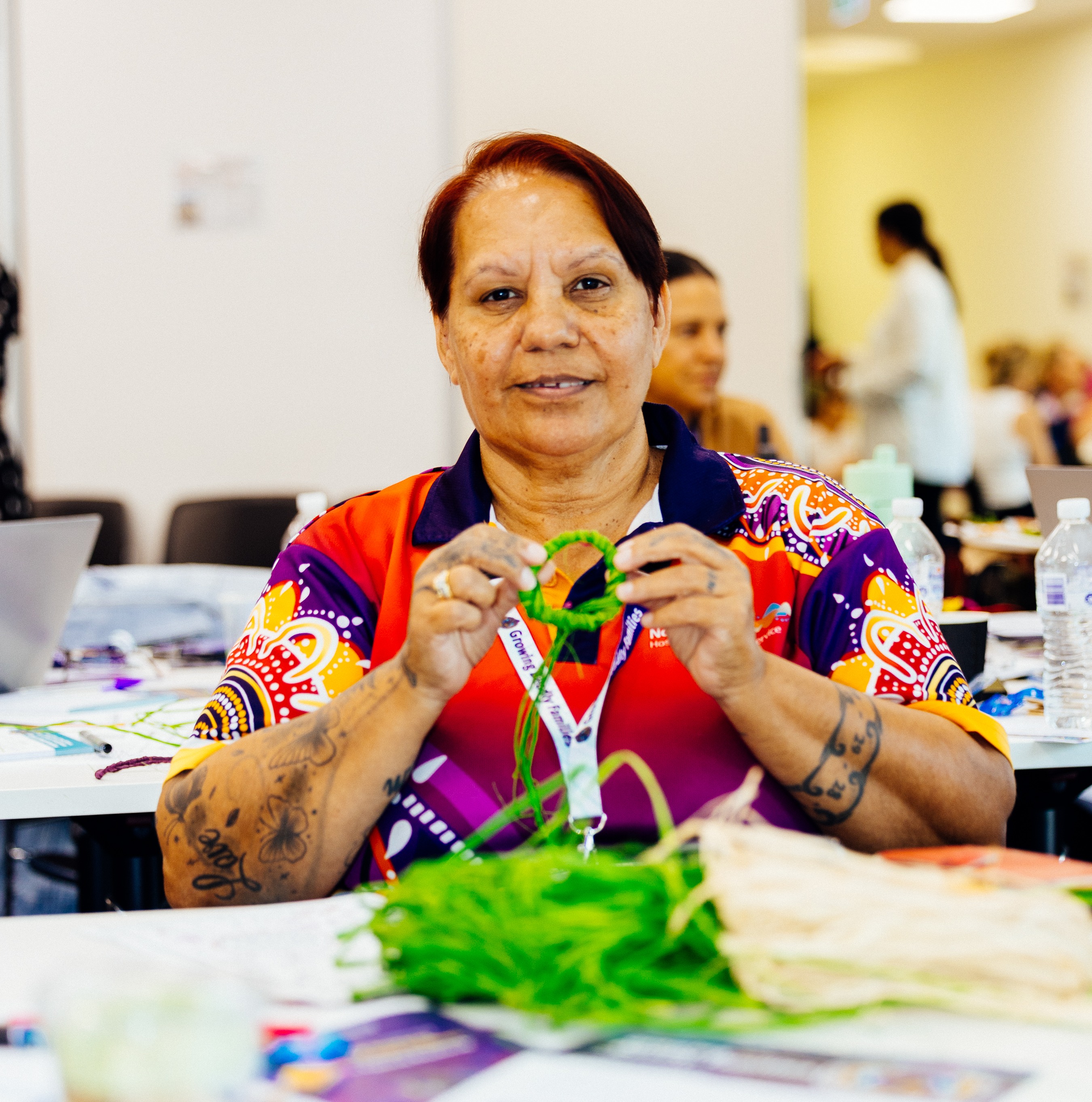 Aboriginal and Torres Strait Islander Health Practitioner Venessa Redcliffe weaving at the Growing Deadly Families Community of Practice Forum.