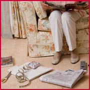 A photo showing clutter on the floor that can be a hazard in the lounge room