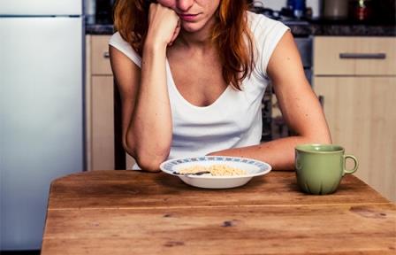 Lady sitting at a table with a meal