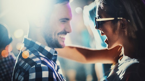 Young man and woman dancing together