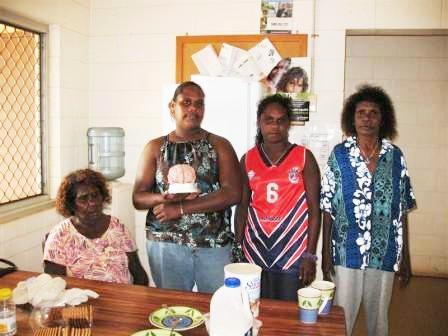 A group of participants from an ABI training session having morning tea