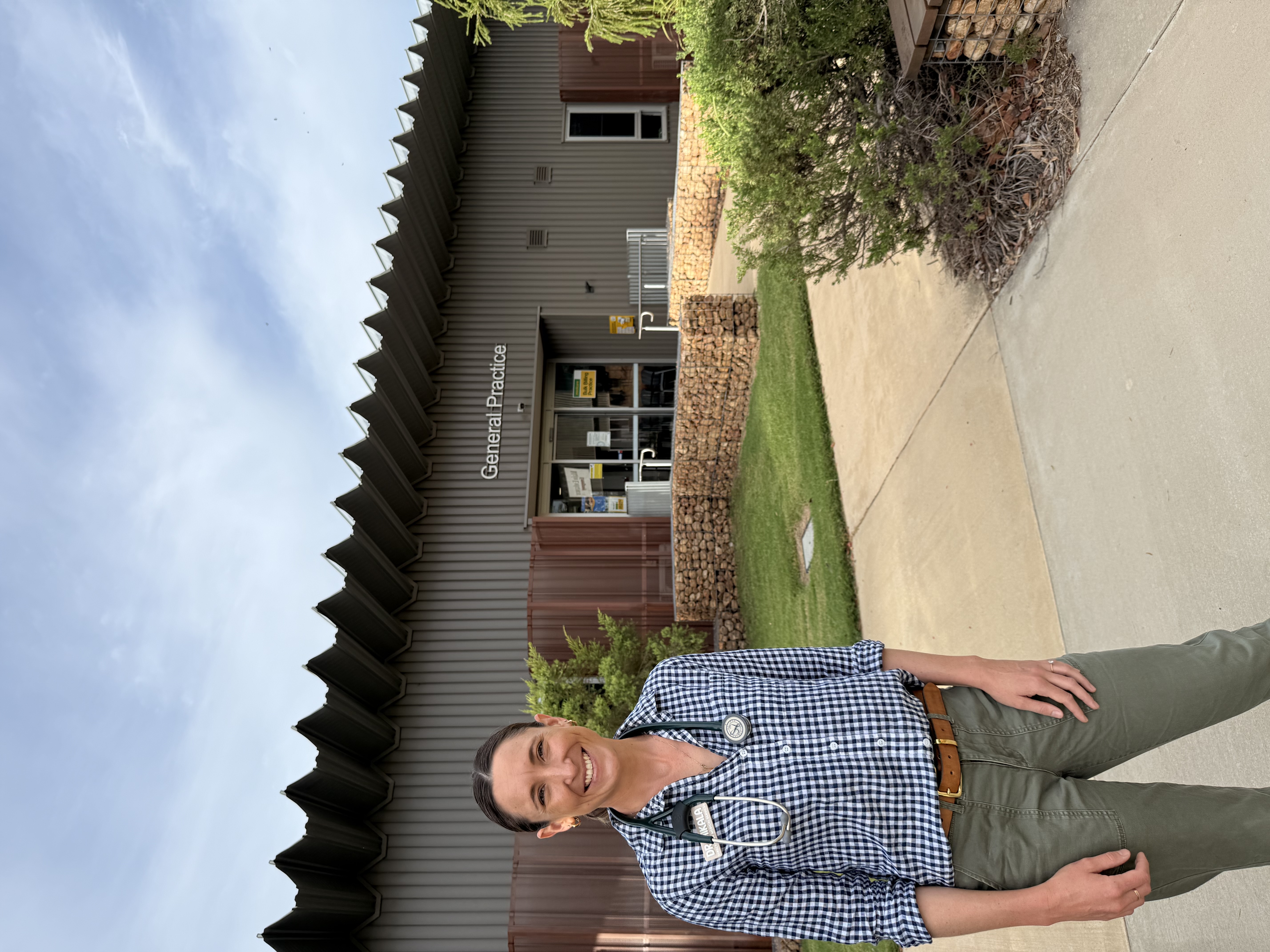 Dr Dales smiles at the camera with the Blackall General Practice in the background.