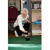 thumbnail image of older woman playing carpet bowls