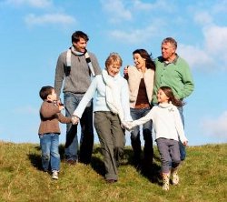 family running down a hill