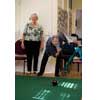 thumbnail image of older people playing carpet bowls
