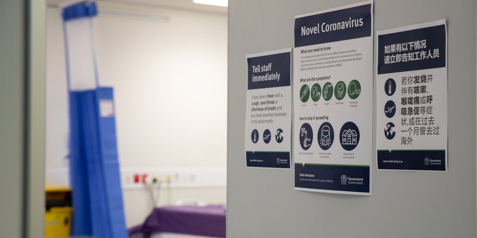 hospital room with posters about coronavirus